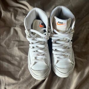 Nike White High-Top Sneakers with Orange Logo